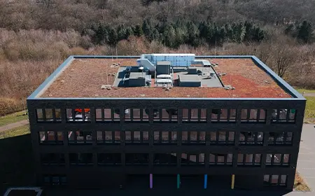 Case study: drone view of the modern healthcare center featuring a moss-covered roof.