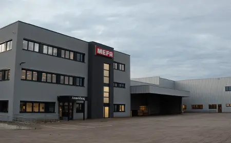 Case study: facade and entrance of the MEFA logistics center featuring the MEFA logo.