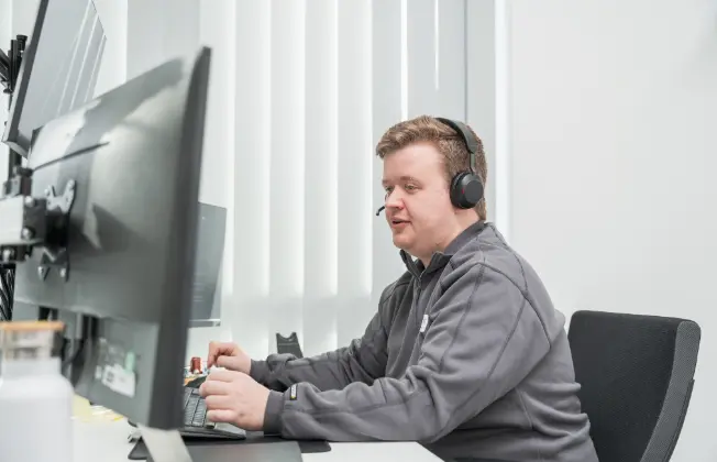 WATERKOTTE service employee wearing a headset.