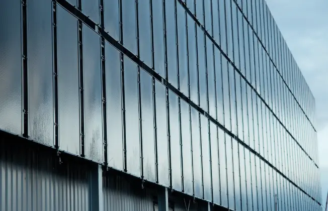 Building facade with large-area solar absorbers installed.